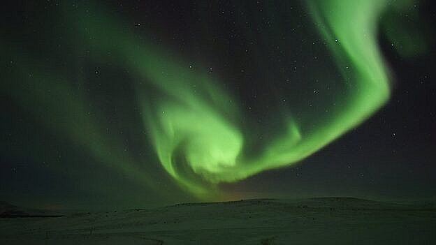 Længere mod nord er nordlyset et noget mere imponerende syn. Billedet her er fra Island.